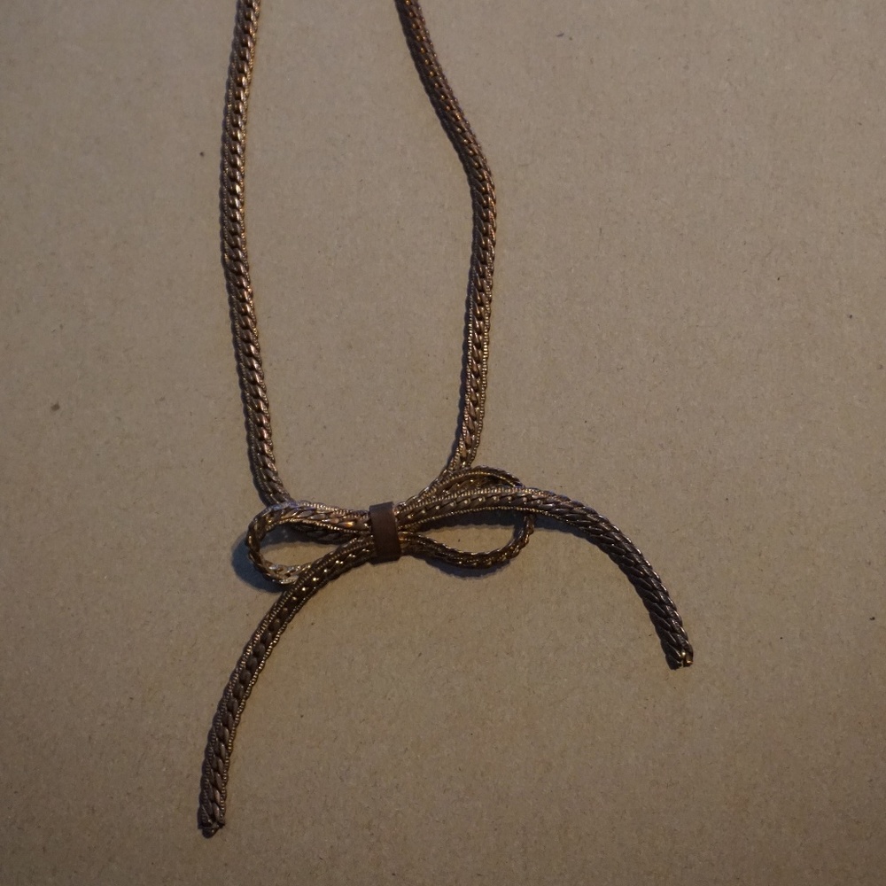 Cute dark gold tie necklace